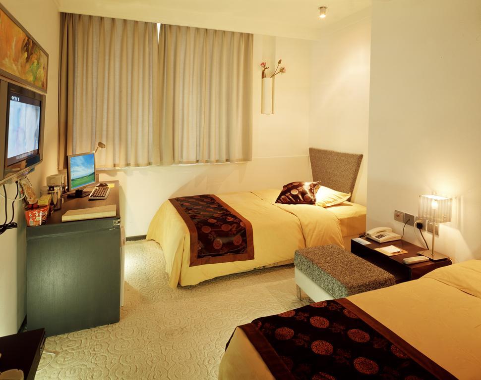 Dalian San Jiang Business Hotel Zimmer foto